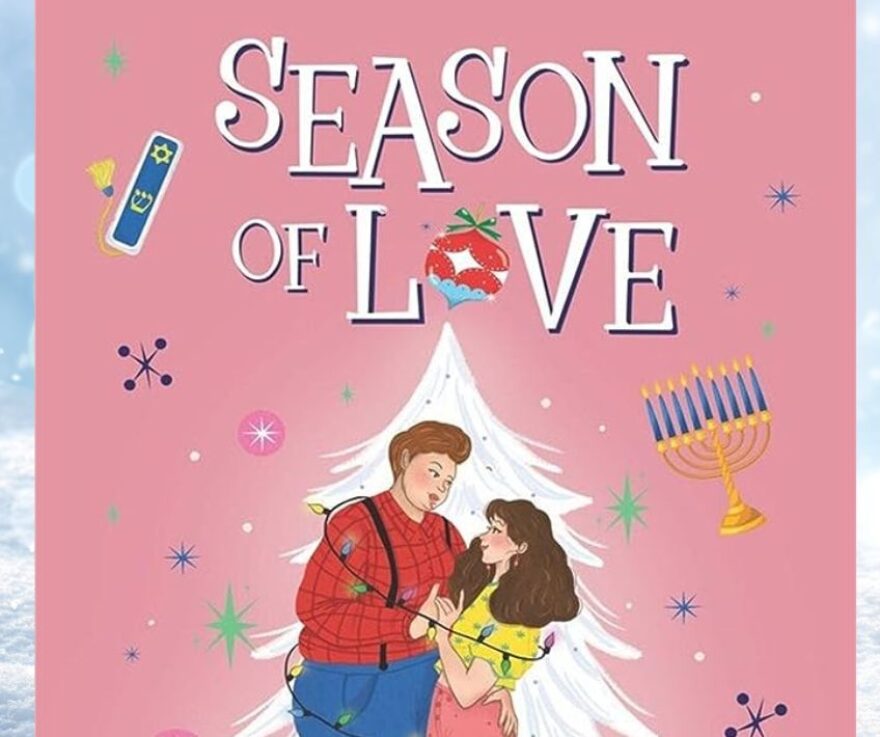 The book cover of Season of Love, which is pink and features a drawing of two women wrapped together in Christmas tree lights. The background of the image is a snowy landscape.