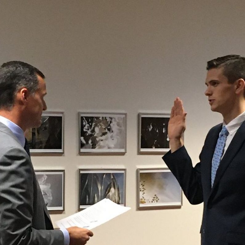 Braeden Sparks '17 being sworn in as an OPD Officer